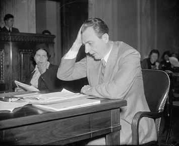 confused man looking at papers